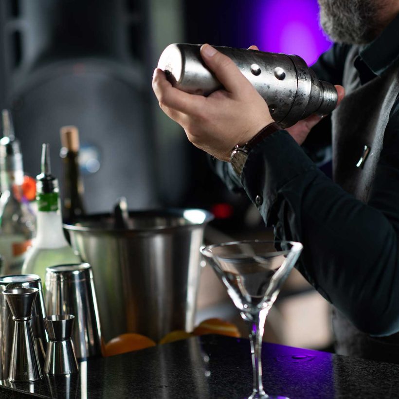 bartender-mixing-delightful-cocktail-in-the-shaker